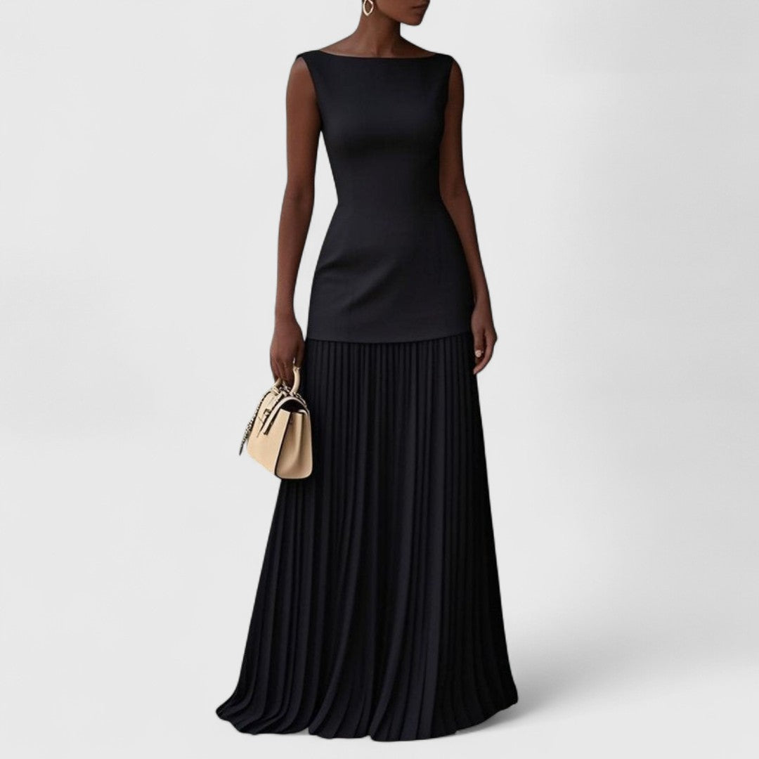 Αργυρώ - Μακρύ πλισέ φόρεμα με ρομαντική κίνηση και διαχρονική χάρη